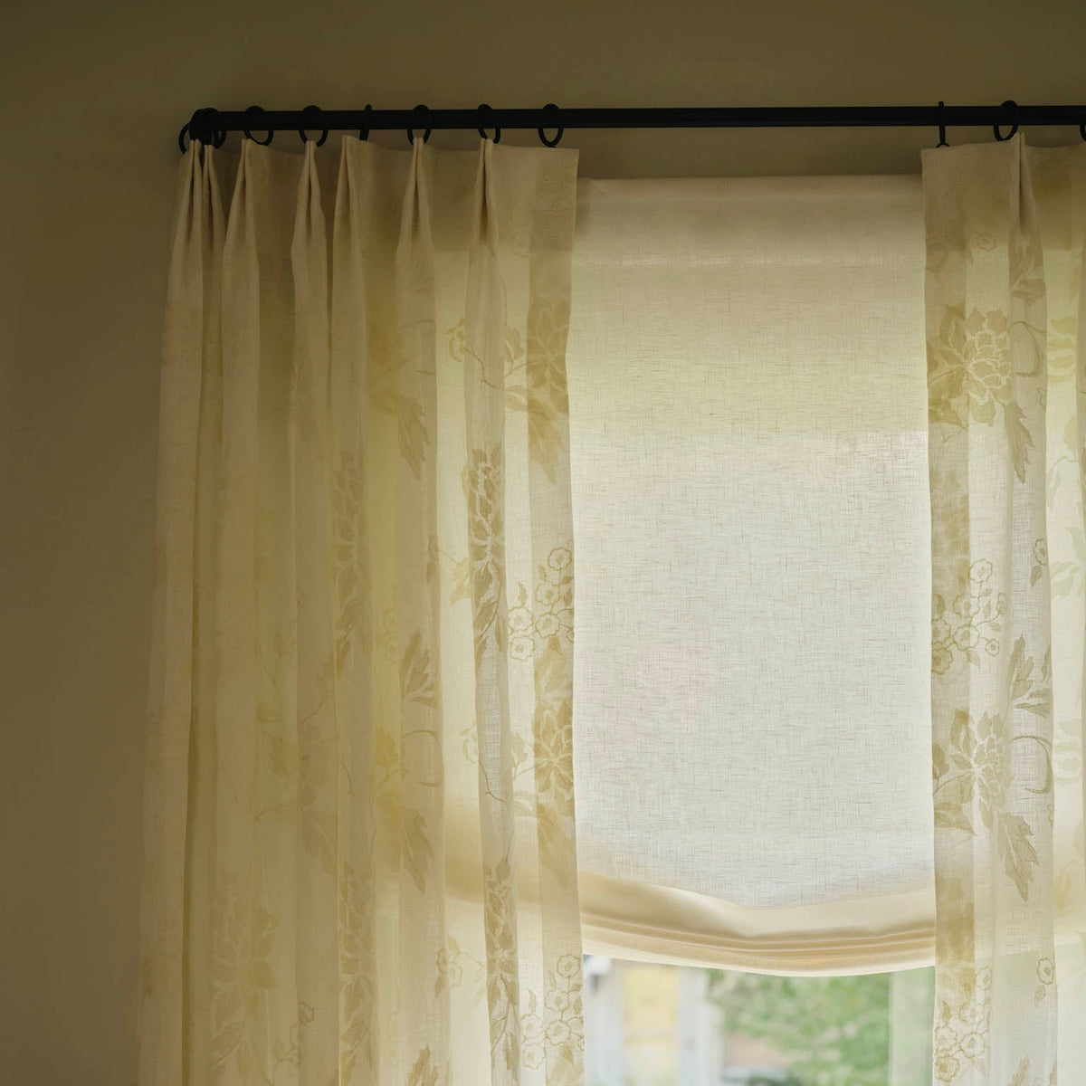 Layered Molly Kidd Studio window treatments.