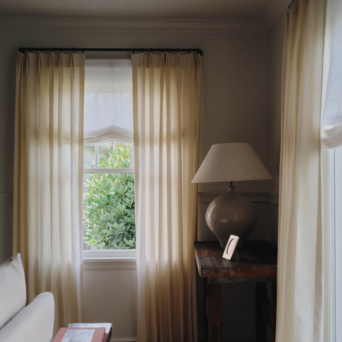 Layered Molly Kidd Studio window treatments.