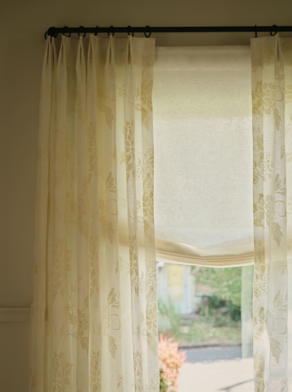 Everhem window treatments styled beside an antique table.