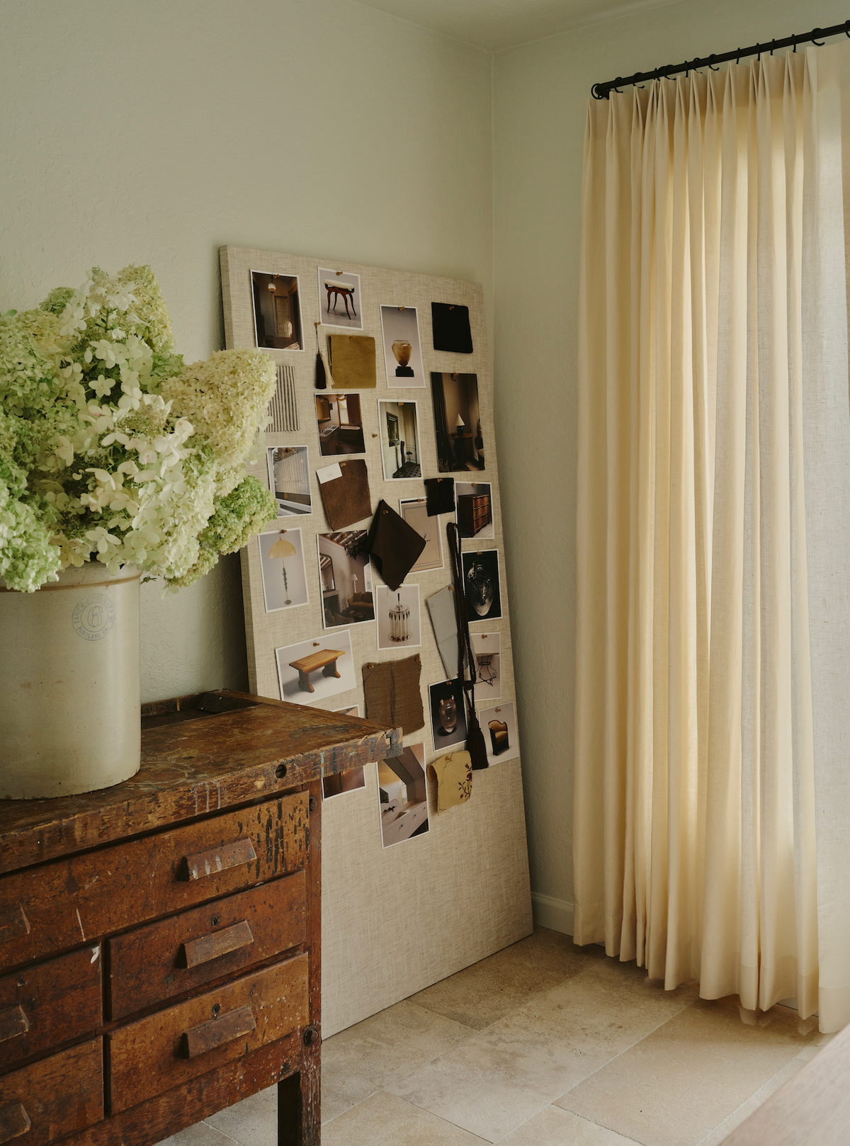 Sheer cafe curtains over double doors.