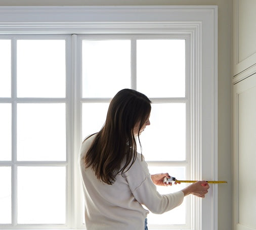 Outside-mount shade with added width coverage on each side